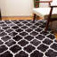 Tapis noir/blanc à zone poils longs géométrique Taos-1807093030
