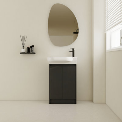 Lavabo autoportant de 23 po. Modèle compact contemporain. Mouvement de porte à fermeture en douceur. Rangement abondant. Schéma de couleur châtaignier noir. Meuble-lavabo de salle de bain facile à décontamine, châtaignier, céramique
