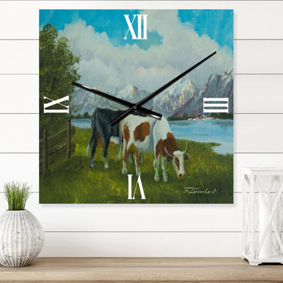 F a Black and a Spotted Cow In Front of a Lake - Farmhouse Wall Clock