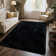 Soft black shag area rug