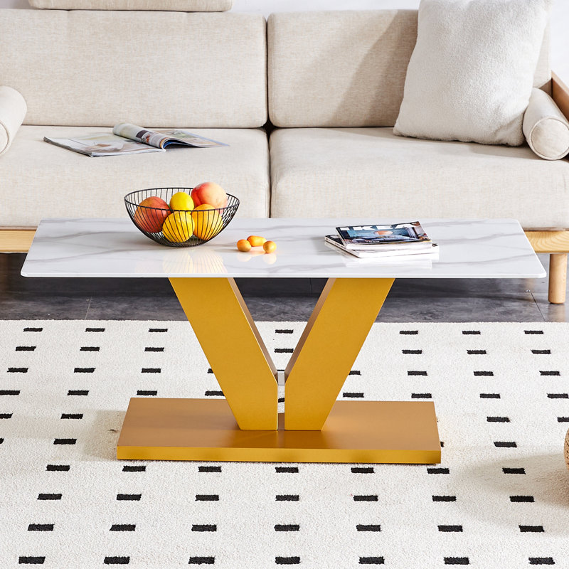 This Elegant Table Combines Durability With A Sleek Design- Featuring A Tempered Glass Tabletop With Stickers And Golden MDF Pillars, Perfect For Living Rooms And Dining Rooms