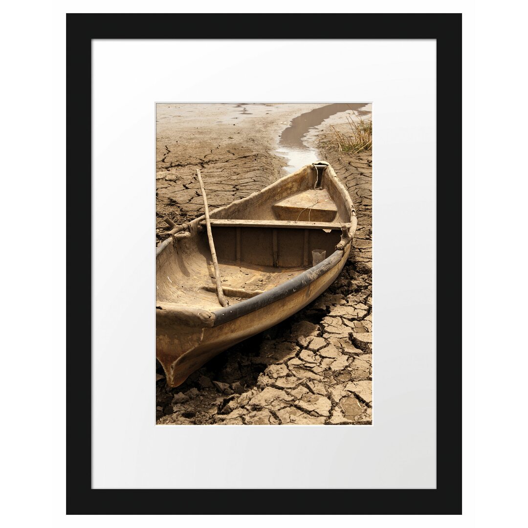 Gerahmter Fotodruck Boat in a Dried-Up Lake