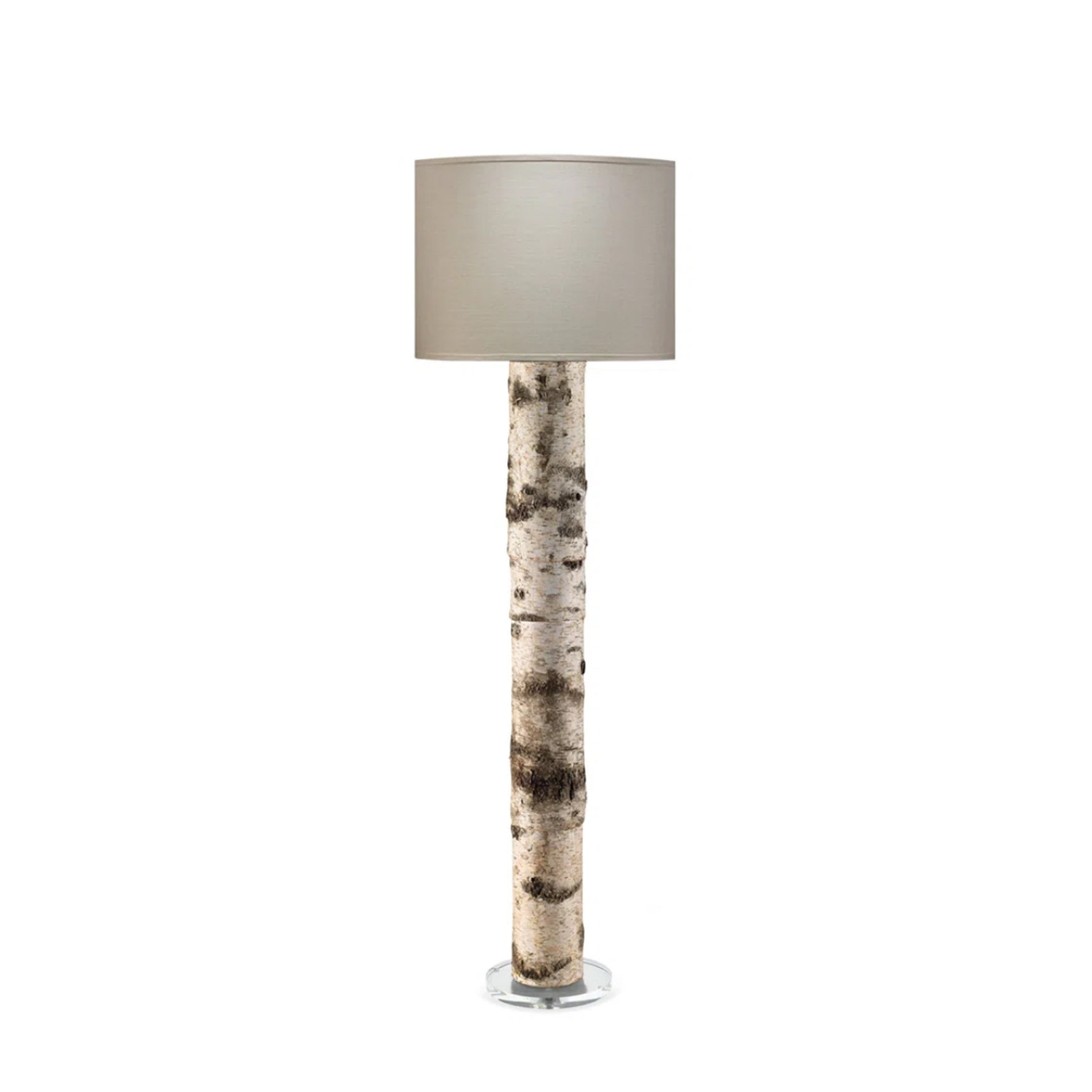 Floor lamp with a cylindrical base featuring a natural white birch wood bark texture and a simple beige drum shade on a circular clear base.