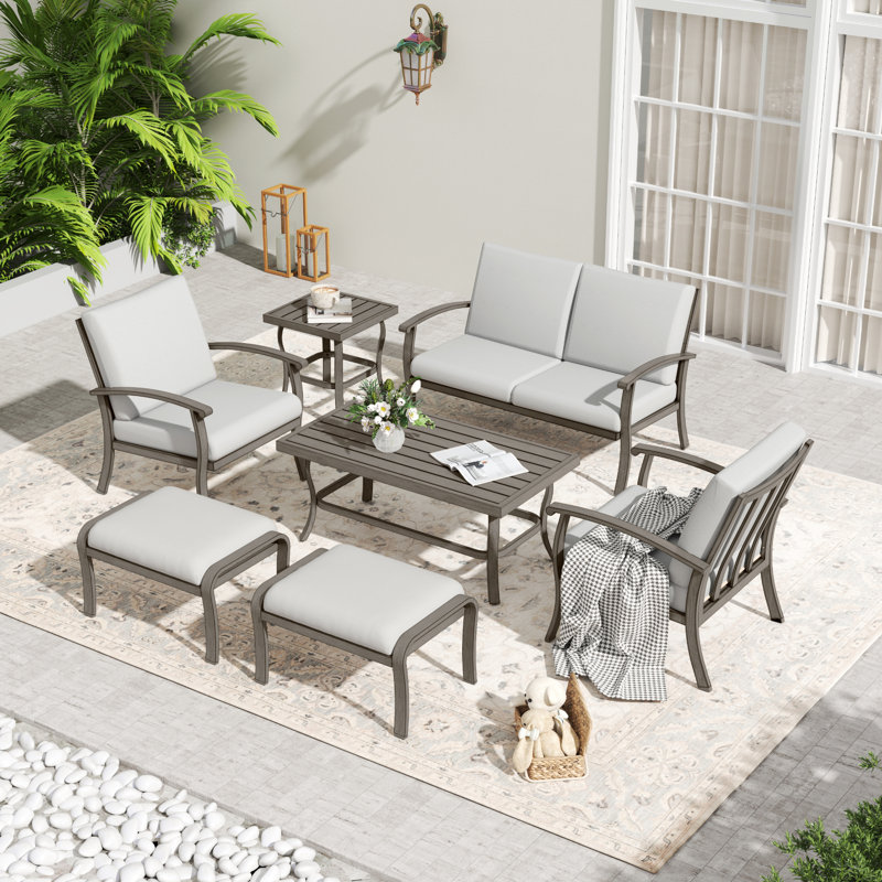 7-Piece Aluminum Patio Conversation Set With Coffee Table, End Table, Ottomans And Light Gray Cushions