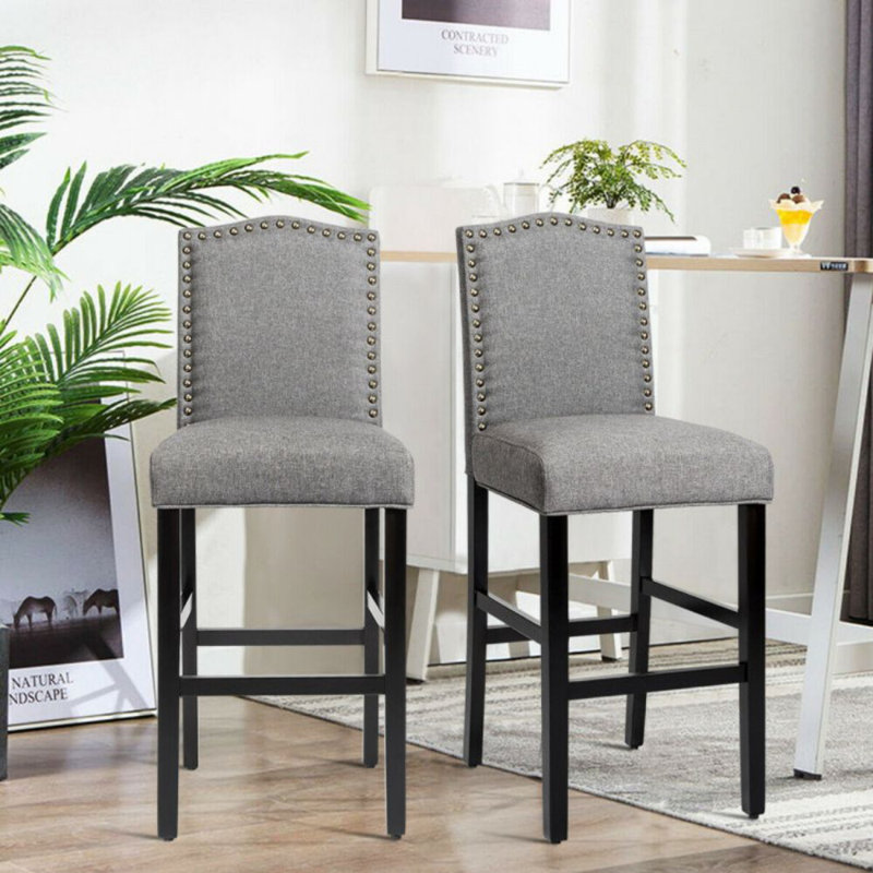 Gray Linen and Dark Wood Counter Height Barstools with Brass Nails