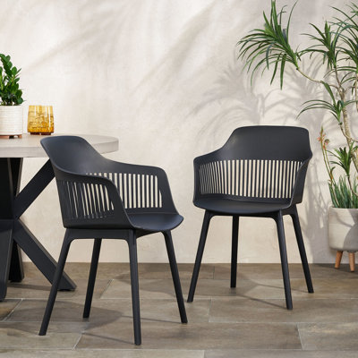 Chaise Dahlia - Extérieur. Polypropylène noir résistant aux intempéries. Courbe élégante. 33 po x 22,5 po x l 21,5 po Cadre stable