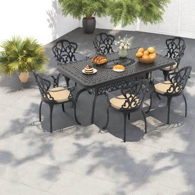 Ensemble repas d'extérieur 7 pièces en fonte d'aluminium avec détails sculptés et coussins résistants aux intempéries