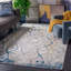 Tapis abstrait en jute / polyester / polypropylène tissé à la machine Carballido en gris / bleu / or-75172707