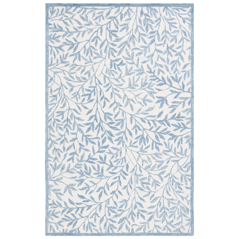 Iqarar Hand Tufted Wool/Cotton Floral Rug in Blue/Ivory, Rectangle 5' x 8'