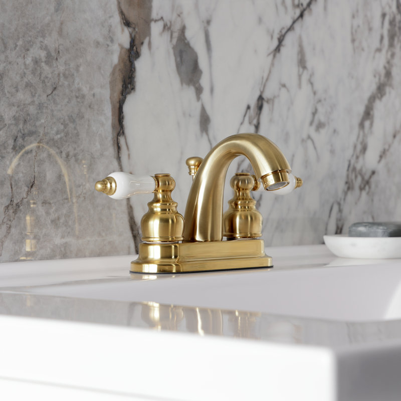 Kingston Brass Restoration Two-Handle 3-Hole Deck Mount 4" Centerset Bathroom Faucet, Brushed Brass