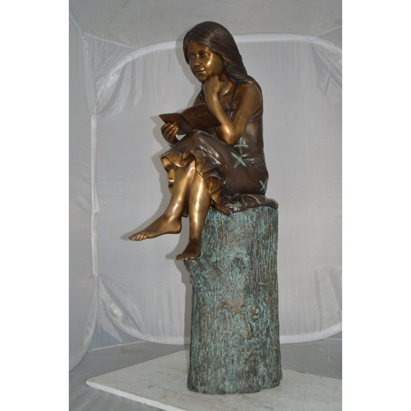 Sitting Girl On Log Reading A Book Bronze Statue -  Size: 19"L X 13"W X 48"H.