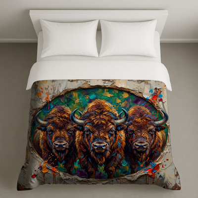 Trois buffles peignant des housses de couette