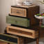 Petite armoire à 4 tiroirs Fienley Staggered avec matériaux mixtes artistiques, poignées rétro et design compact