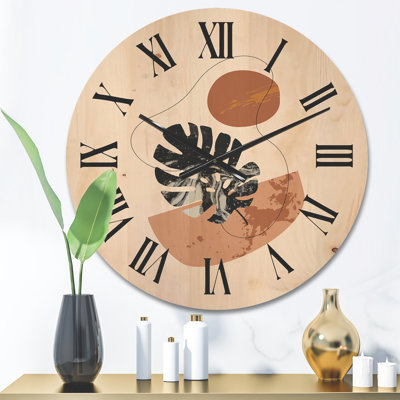 Horloge murale en bois à formes abstraites et feuilles de Monstera tropicales