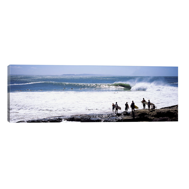 Silhouette Of Surfers Standing On The Beach, Australia by Panoramic Images - Wrapped Canvas Panoramic Print