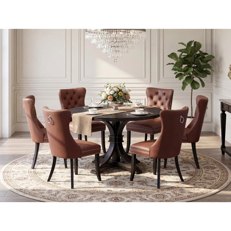 L'ensemble de table de salle à manger 7 pièces comprend une table ronde de 48 po avec piédestal et 6 chaises rembourrées en similicuir bourgogne, noir sablé