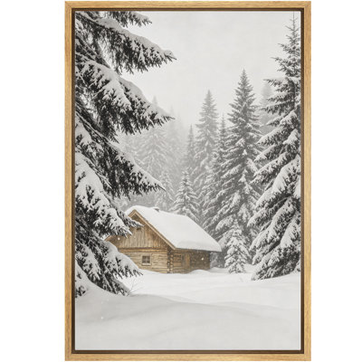 Chalet en bois rond chaleureux dans une forêt de conifères enneigée - Tableau encadré sur toile pour chambre principale