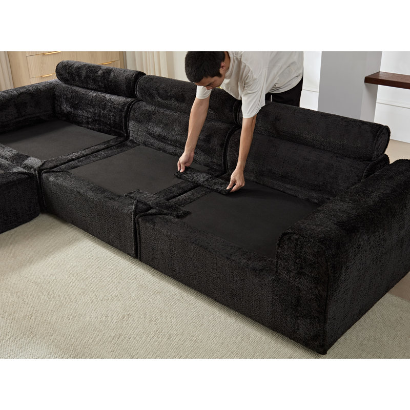 Canapé d'angle modulaire surdimensionné en boucle noire, idéal pour un salon familial., Noir