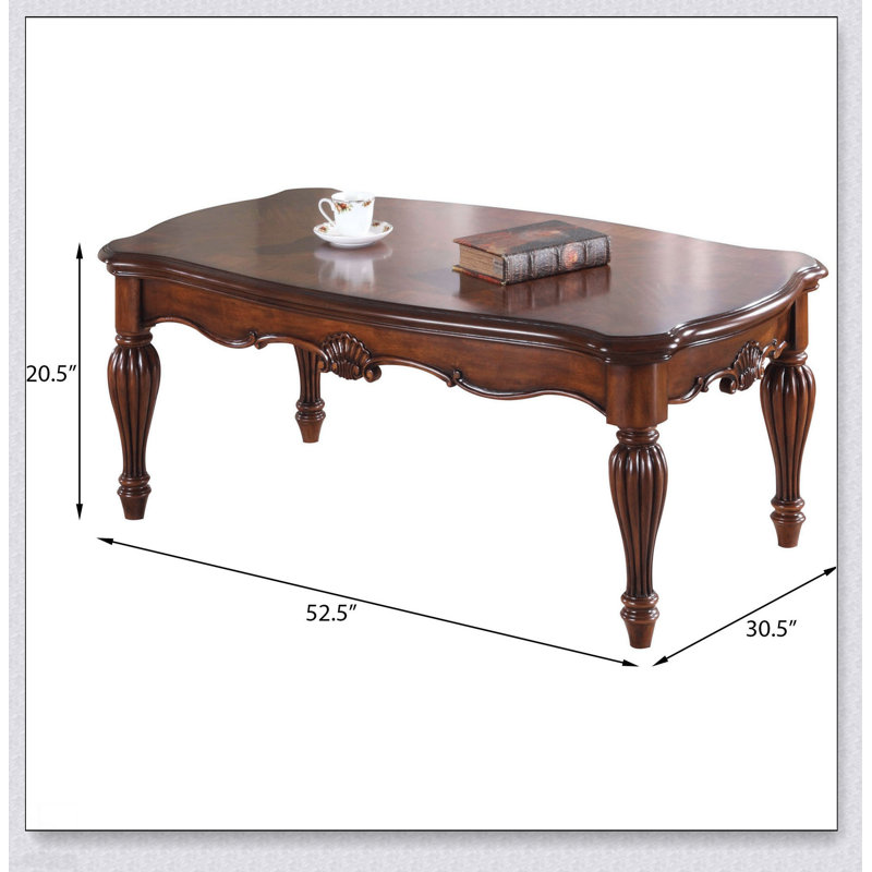 Table basse en cerisier rectangulaire avec pieds tournés, parfaite pour l'élégance classique et les espaces de vie fonctionnels.