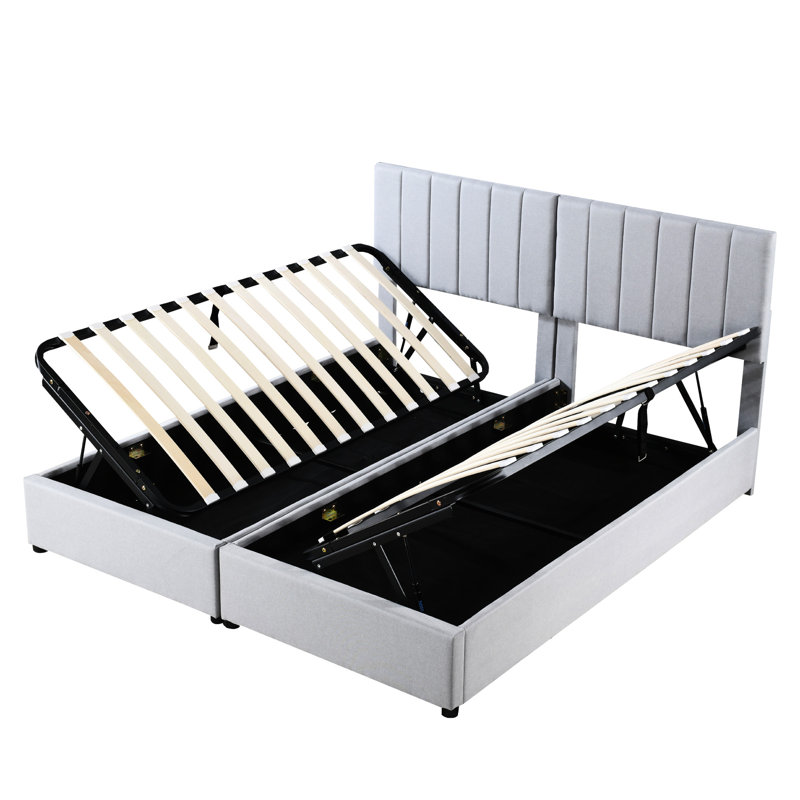 Très grand lit tapissier avec rangement hydraulique, revêtement gris et rangement efficace