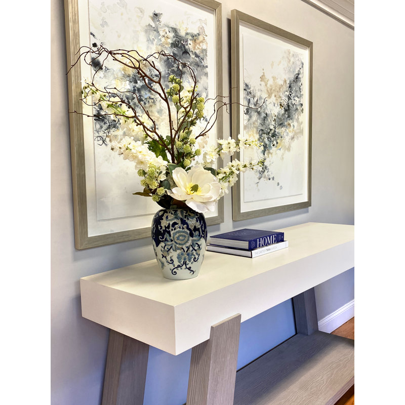 Magnolia and Delphinium Arrangement in a Decorative Ceramic Vase
