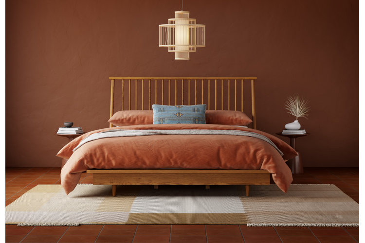 modern boho bedroom with terracotta walls, floors, and bedding