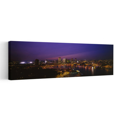 Aerial View Of A City Lit Up At Dusk Baltimore Maryland USA by Blakeway Worldwide - Wrapped Canvas Panoramic Print