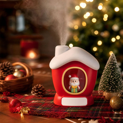 Humidificateur de table portable en forme de maison de Noël avec figurine du Père Noël, idéal pour la maison, la chambre ou le bureau. Décoration lumineuse pour les fêtes.