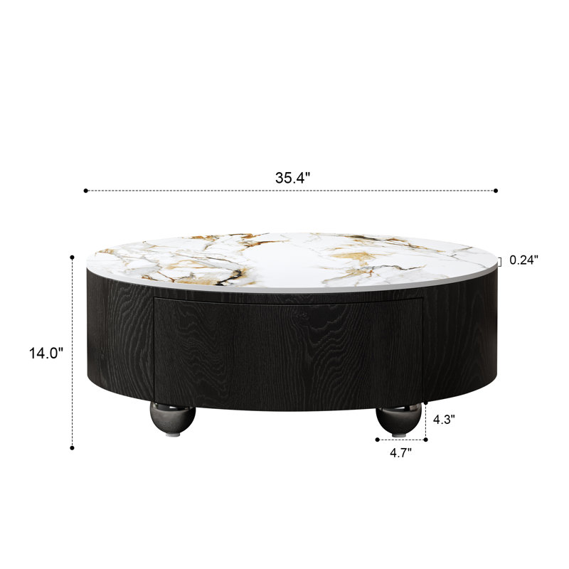 Table basse ronde en pierre frittée et MDF, plateau en faux marbre monobloc, piètement en placage noir, 2 tiroirs et pieds en acier.