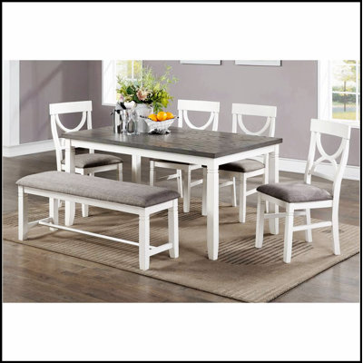Ensemble de salle à manger 6 pièces en bois avec chaises rembourrées et banc Carrol, parfait pour les intérieurs modernes et classiques.