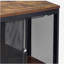 Table basse rétro en chêne et noire avec 4 portes coulissantes.