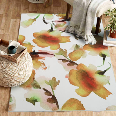 Tapis orange et jaune à motif floral