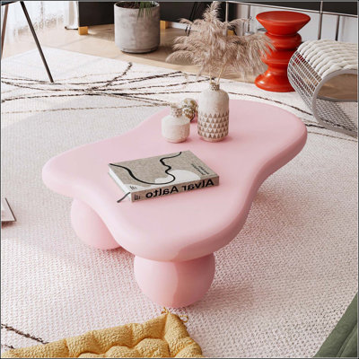 Table basse en forme de nuage avec 3 pieds sphériques
