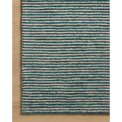 Tapis océan / ivoire Ebern Designs Malpass
