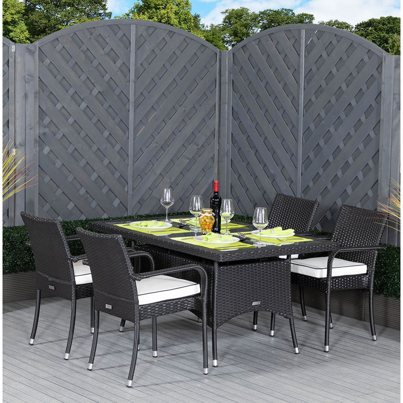 Flaherty 4 - Person Patio Dining Set with Rectangular Table , Cushions Included, Black/Vanilla