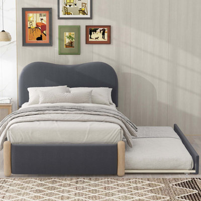 Full Upholstered Platform Bed With Wood Supporting Feet And Twin Trundle