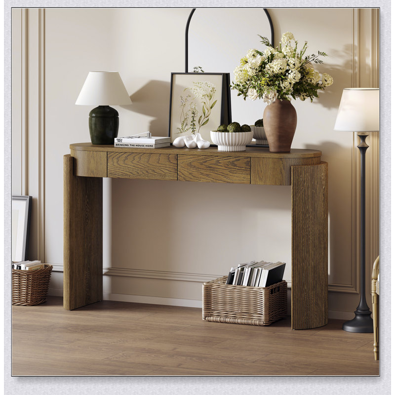 Table d'entrée avec finition grain de bois naturel, conception cannelée, plateau ovale et 2 tiroirs pour un décor moderne