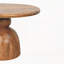 Table basse sur piédestal en bois sculpté