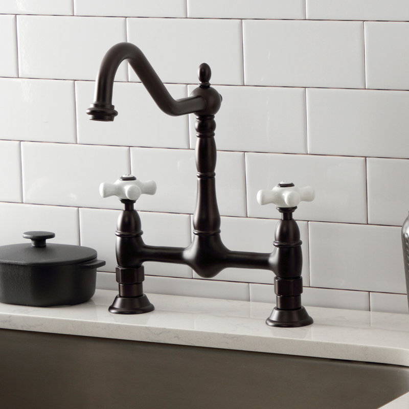 Kingston Brass Heritage Two-Handle 2-Hole Deck Mount Bridge Kitchen Faucet, Oil Rubbed Bronze/White