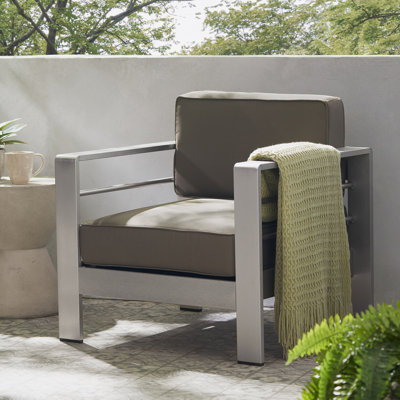 CHAISE CLUB AVEC COUSSIN COMPRIMÉ