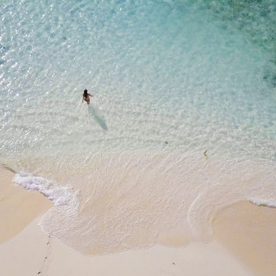 Aerial View of Woman in Shallows by Ascentxmedia