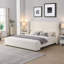 Lit tapissier élégant en tissu blanc avec tête haute