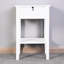 Table de rangement blanche sur pied avec table de chevet et table de chevet blanche