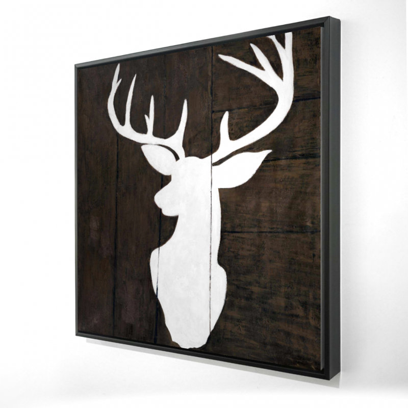 "Silhouette d'un cerf sur bois"
