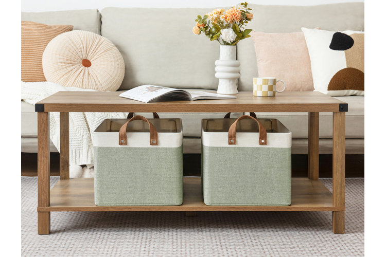 two fabric storage bins under a coffee table