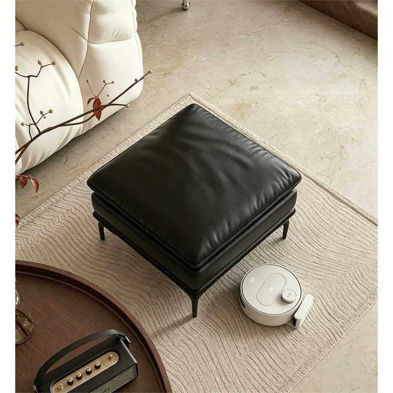 Repose-pieds en cuir noir avec repose-pieds