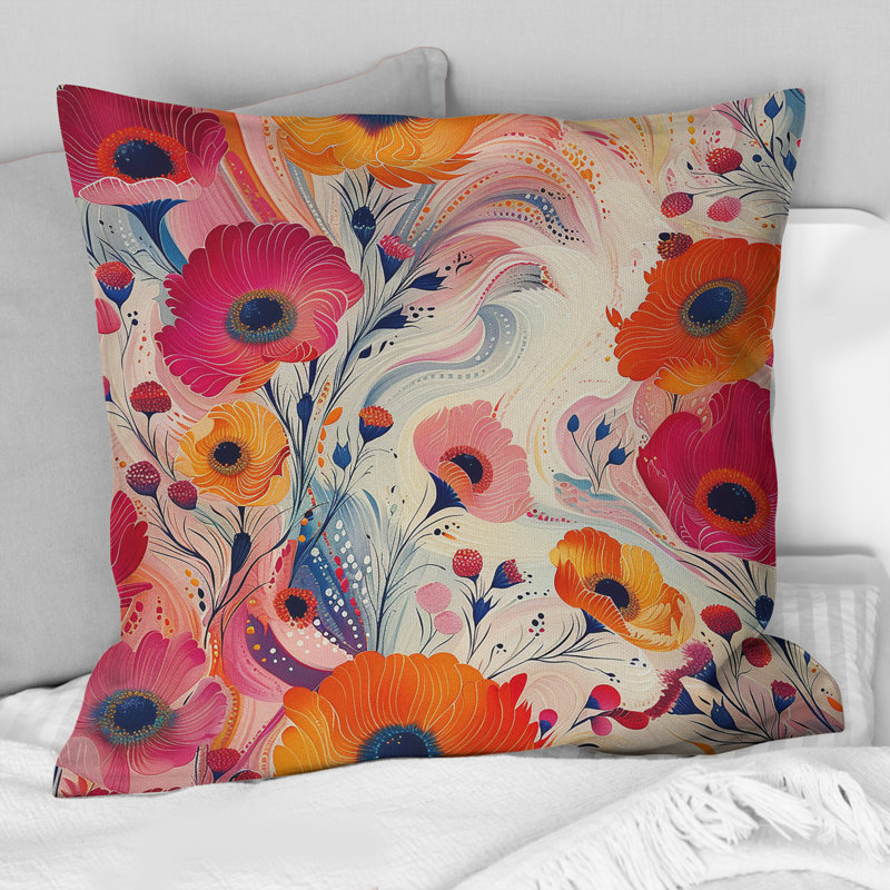 Coussin décoratif orange et rose avec motifs floraux et fantaisie, H 16 po x l 16 po