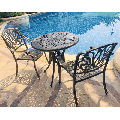 Akshara 2 - Person Patio Dining Set Umbrella Hole Included Round Table
