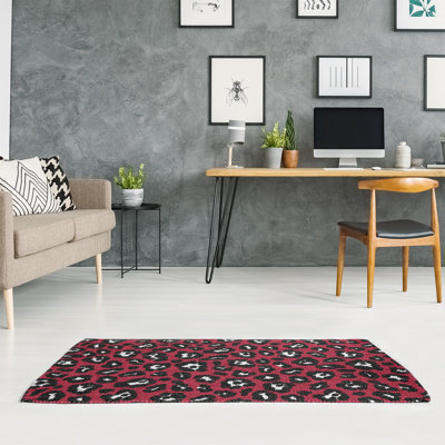 Tapis rouge / noir / blanc à imprimé animal