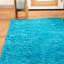 Tapis turquoise tissé à la machine Deatherage-662684092